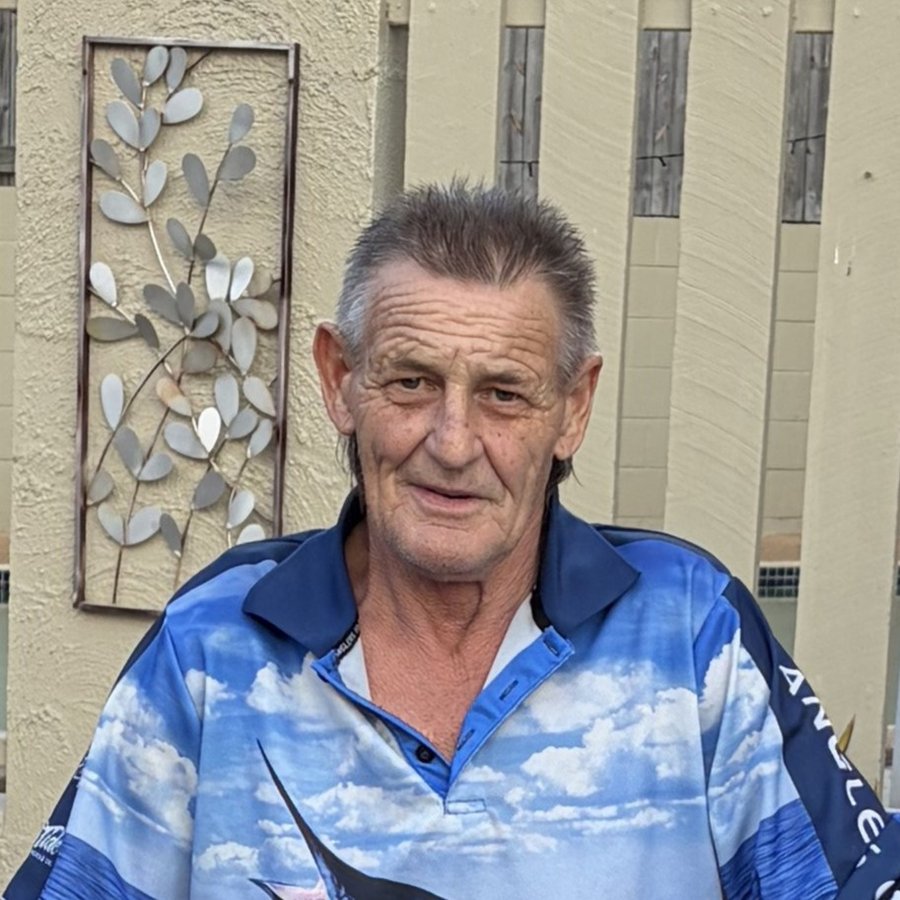 Dicko, head and shoulders, in a blue fishing shirt